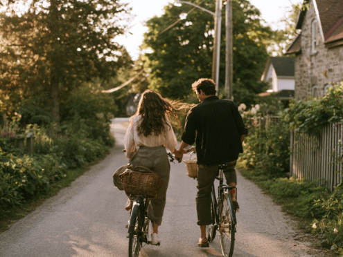 Scene 14 storyboard: a couple cycling along a tree-lined lane